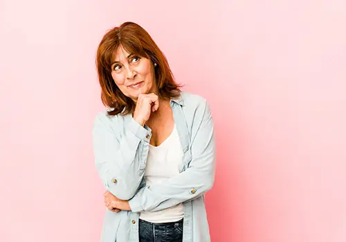 woman looking sideways with doubtful and skeptical expression.