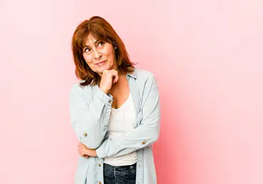 woman looking sideways with doubtful and skeptical expression.