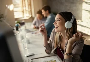 woman listening to music while working