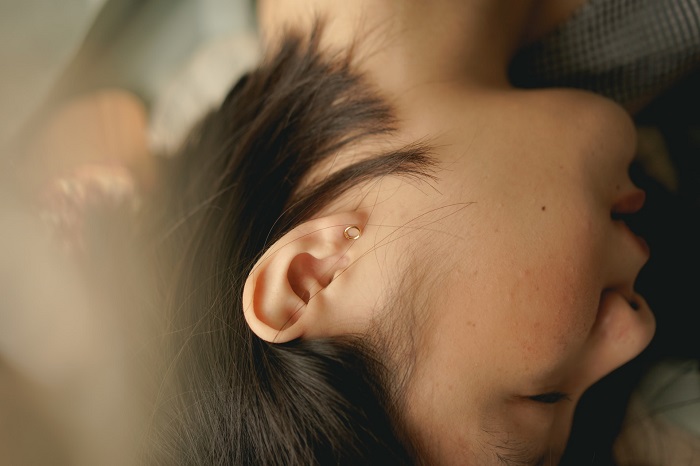 Ear health and hearing loss have massive impacts on overall quality of life. Photo by Jessica Flavia on Unsplash.