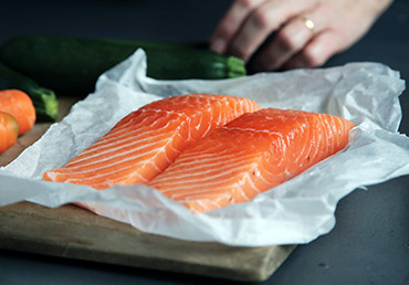 protein-rich food salmon is being prepared for cooking