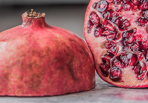 A pomegranate is photographed.