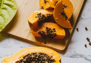 Papaya slices are photographed.
