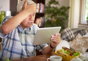 Senior man surprised by a scam