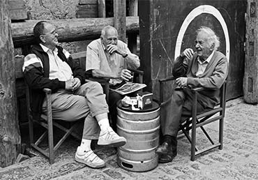 3 Friends sitting having a chat