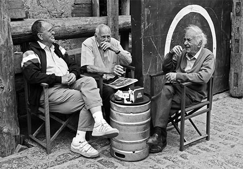 3 Friends in their social circle sitting having a chat 