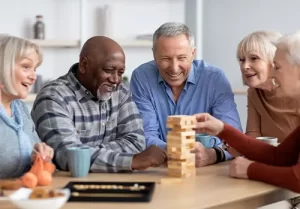 seniors playing Jenga at community center