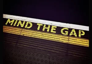 Photo Of A Sign That Reads: Mind The Gap