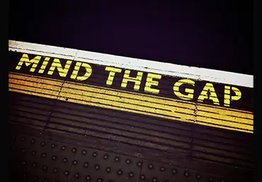 Photo Of A Sign That Reads: Mind The Gap