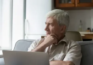 medicare faqs for seniors senior thinking looking away pondering hand on chin large image