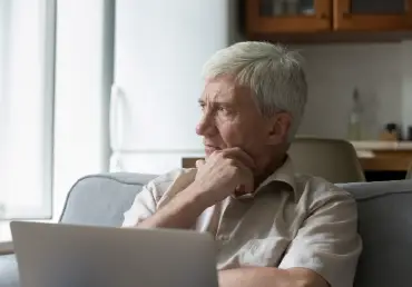 medicare faqs for seniors senior thinking looking away pondering hand on chin thumbnail image