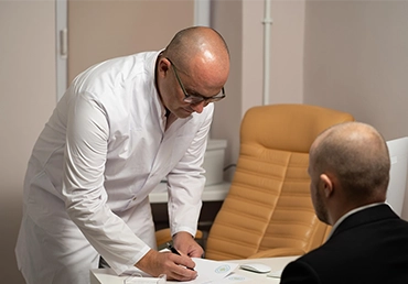 doctor and man in an office