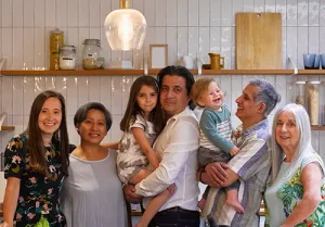 Portrait of smiling family in kitchen