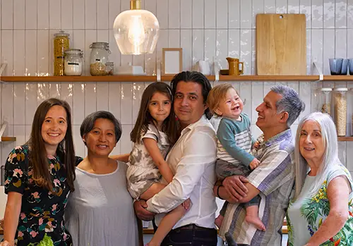 Portrait of smiling family in kitchen 