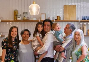 Portrait of smiling family in kitchen