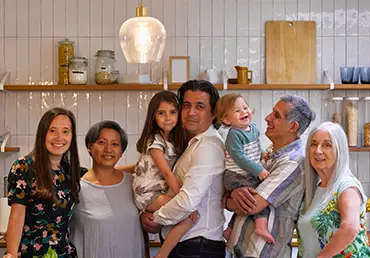 Portrait of smiling family in kitchen