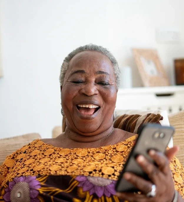 senior african american woman smiling talking on a phone