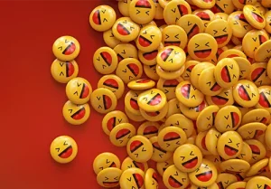 3d rendering of a bunch of yellow laughing emojis glossy pins over red background
