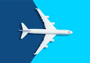 Flat lay design of travel concept with plane on blue background.